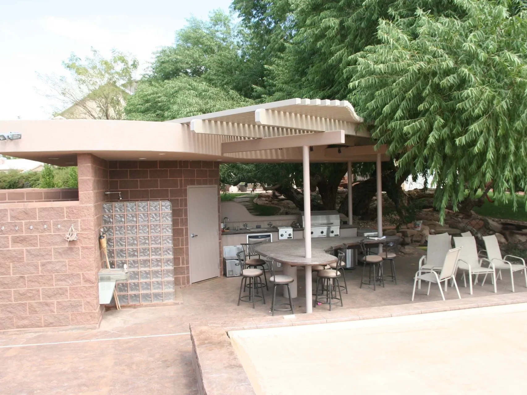 Custom lattice awning near a pool