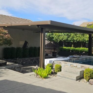 Solid top aluminum patio cover in brown